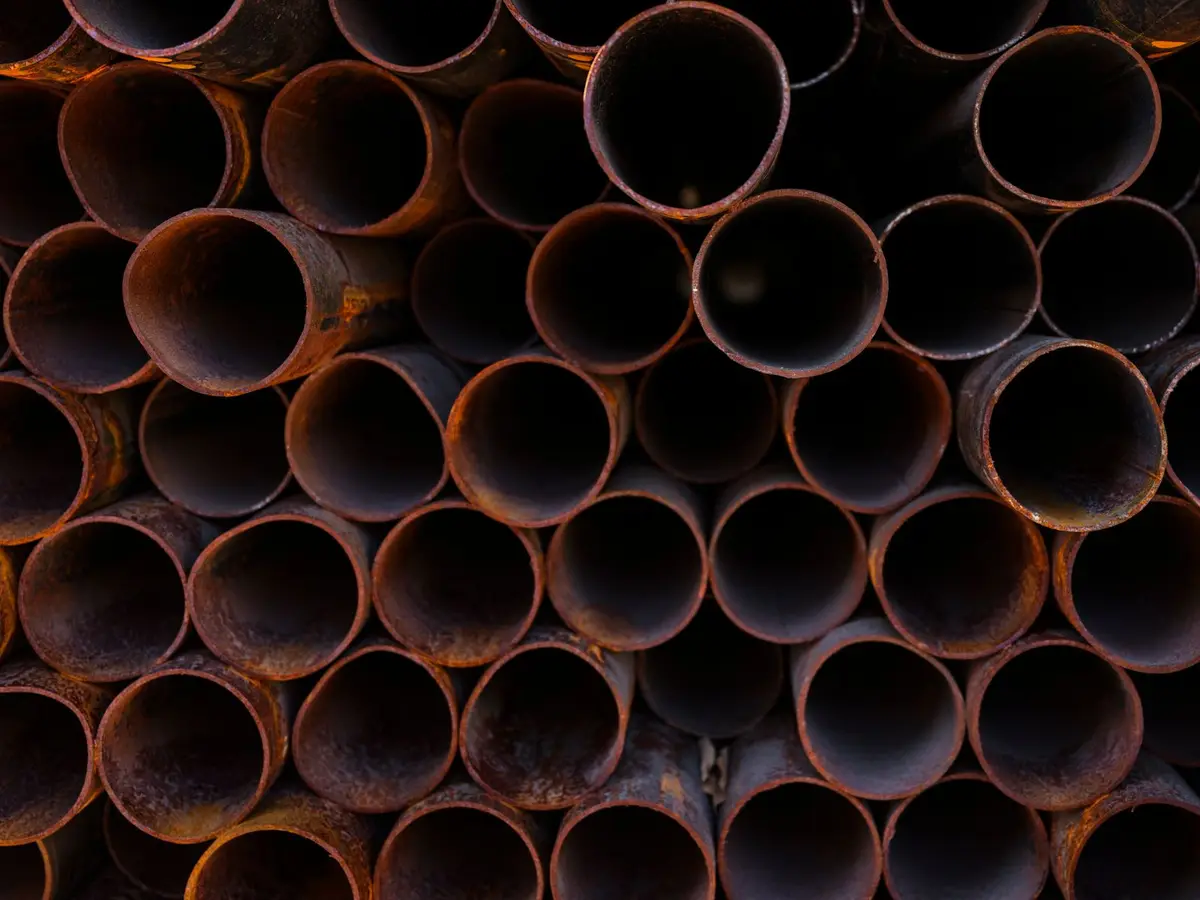 Example: stack of heavily rusted metal pipes